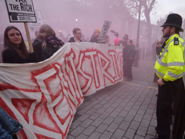 Students take part in a protest against tuition fees in central London