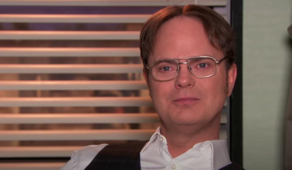 Dwight Schrute staring away at the camera while getting ready to speak