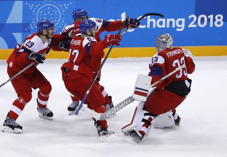 Ice Hockey - Pyeongchang 2018 Winter Olympics - Men's Quarterfinal Match - Czech Republic v U.S. - Gangneung Hockey Centre, Gangneung, South Korea - February 21, 2018 - Goalie Pavel Francouz of the Czech Republic celebrates with teammates after their shootout victory. REUTERS/Brian Snyder