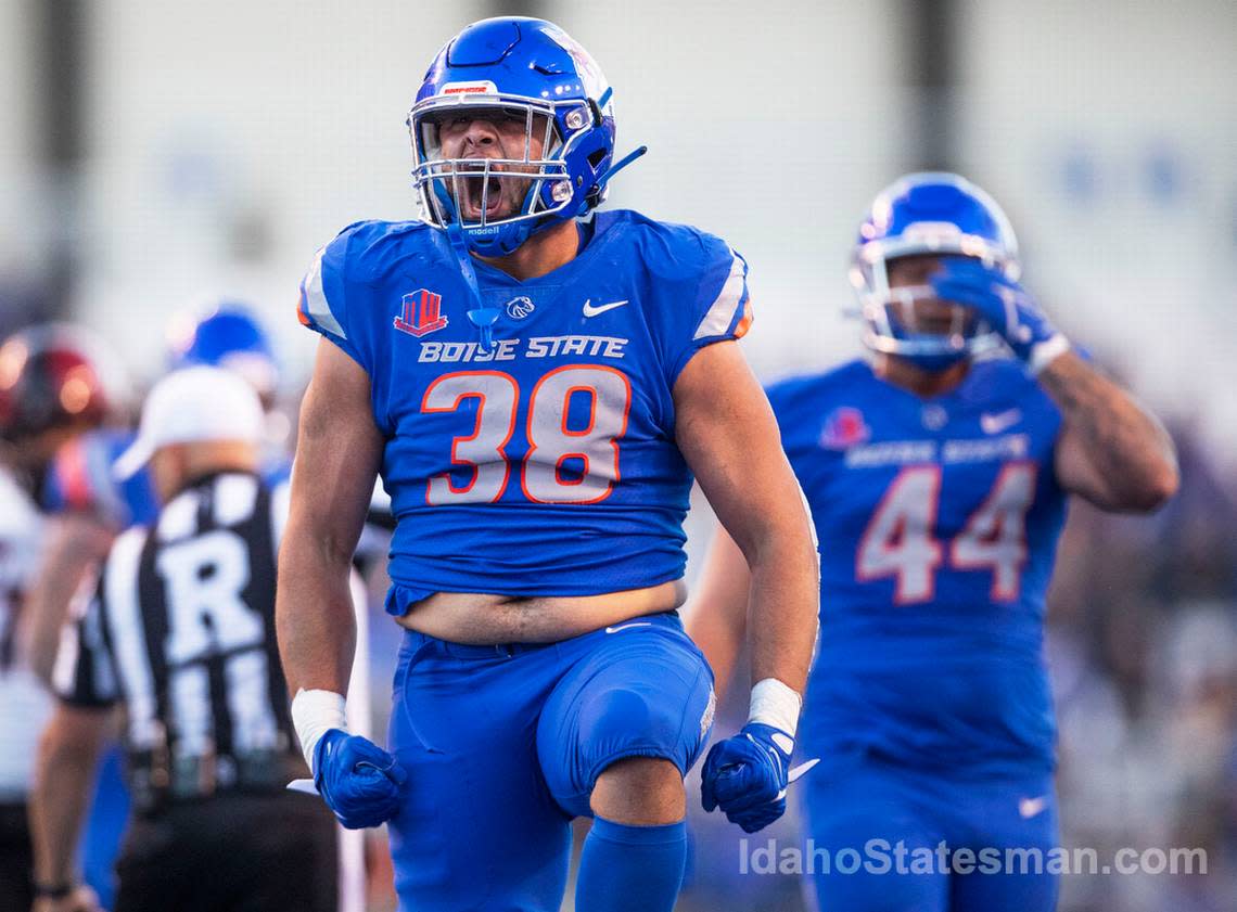 Boise State edge Demitri Washington gets the crowd at Albertsons Stadium energized after the defense sacked San Diego State quarterback Braxton Burmeister, Friday, Sept. 30, 2022 in Boise.