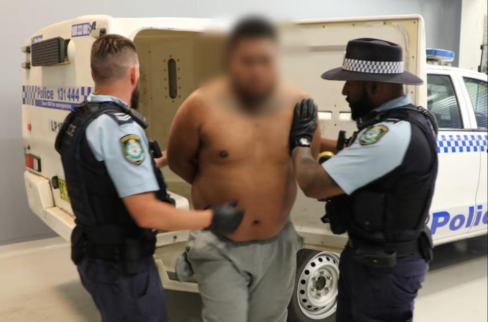 A man arrested following the raids. Picture: NSWPF