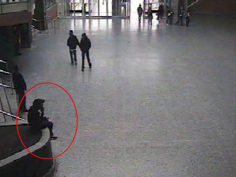 A CCTV still shows suicide bomber Salman Abedi sitting in the foyer of the Manchester Arena during a reconnaisance visit on 21 May 2017Manchester Arena Inquiry