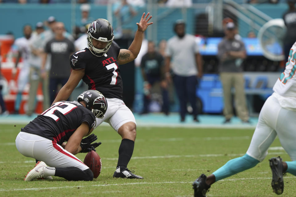 Atlanta Falcons kicker Younghoe Koo (7) kicks the winning field goal, as the ball is held by teammate Atlanta Falcons punter Dustin Colquitt (12), during the second half of an NFL football game against the Miami Dolphins, Sunday, Oct. 24, 2021, in Miami Gardens, Fla. The Falcons defeated the Dolphins 30-28. (AP Photo/Hans Deryk)