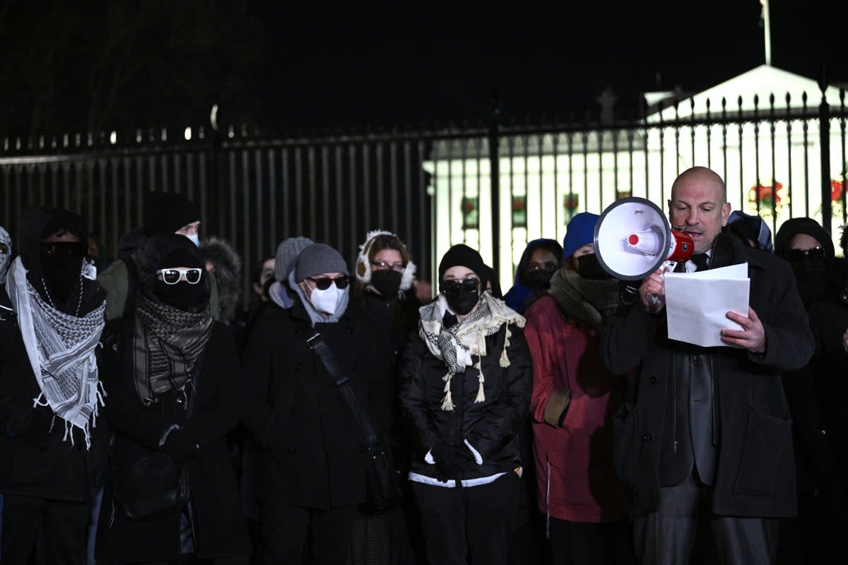Josh Paul, who resigned over the war between Israel and Hamas, speaks during a demonstration calling for a ceasefire in front of the White House in December (AFP)