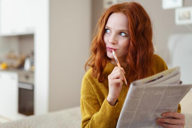 Blonde Woman Playing Chess Online Uses Laptop, Thoughtfully Makes