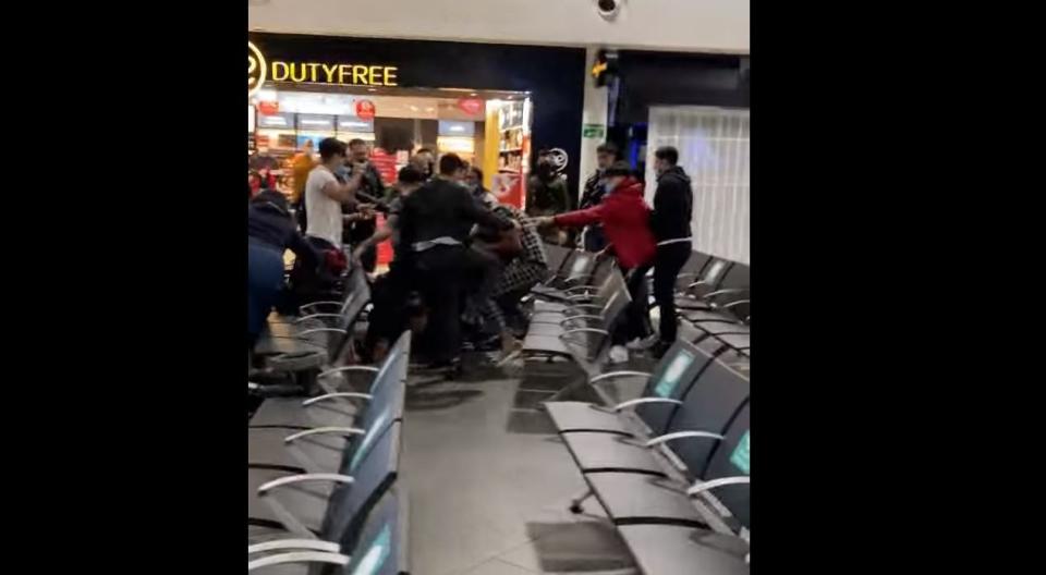 Video of the brawl at Luton Airport was uploaded to social media by other passengers (Fink Finker/Youtube)