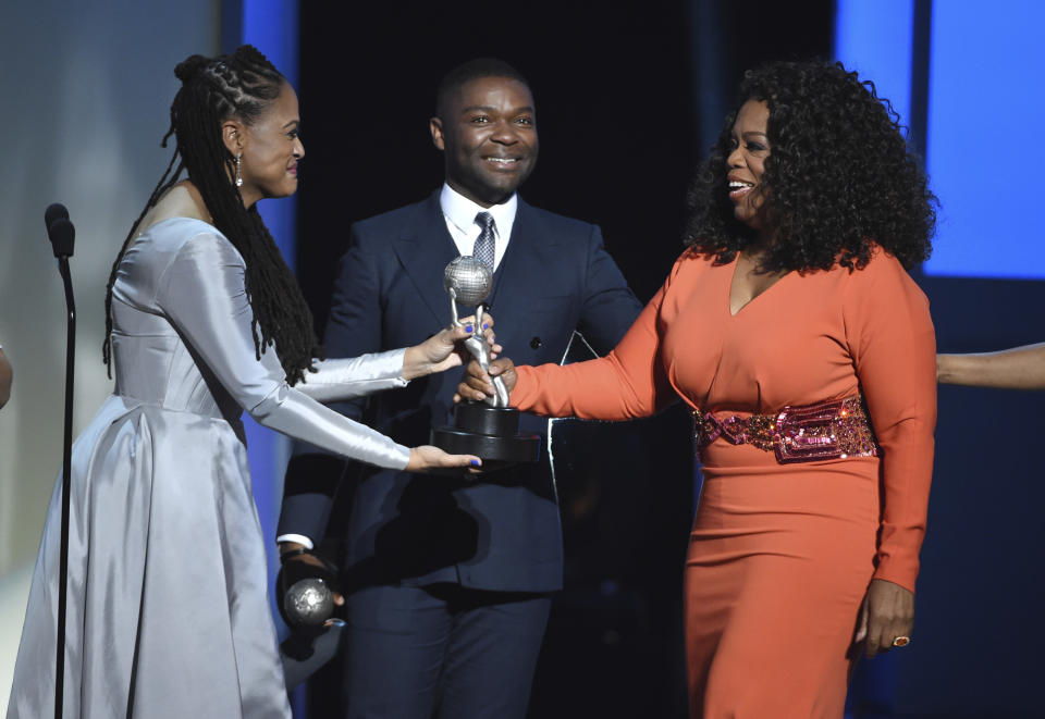 FILE - In this Feb. 6, 2015 file photo, Ava DuVernay, from left, David Oyelowo, and Oprah Winfrey accept the award for outstanding motion picture for "Selma" at the 46th NAACP Image Awards in Pasadena, Calif. Hollywood's record in diversity and inclusion has improved in recent years, but it still lags behind the population — particularly in its executive ranks. (Photo by Chris Pizzello/Invision/AP, File)