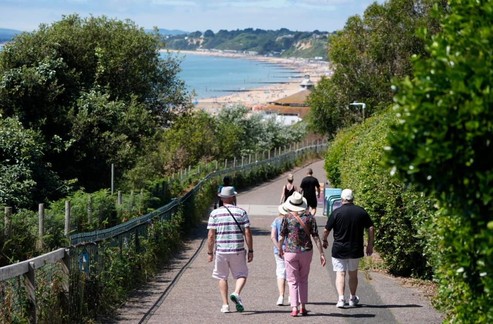 People make their way down towards Bournemouth Beach (Andrew Matthews/PA Wire)