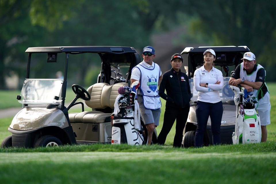 LPGA golfers Bianca Pagdanganan and Xiyu Lin, watch the drives of their amateur competitors, Wednesday, Sept. 7, 2022, during a pro-am portion of the Kroger Queen City Championship golf tournament at Kenwood Country Club in Madeira, Ohio. 