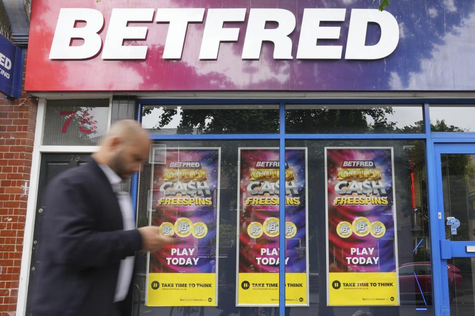 A man walks past a betting shop in London, Wednesday, July 3, 2024. Britain's general election is a big event for political gamblers. Betting on Thursday's election is expected to generate tens of millions of pounds in bets though the biggest event is a bit of a snooze. (AP Photo/Kin Cheung)