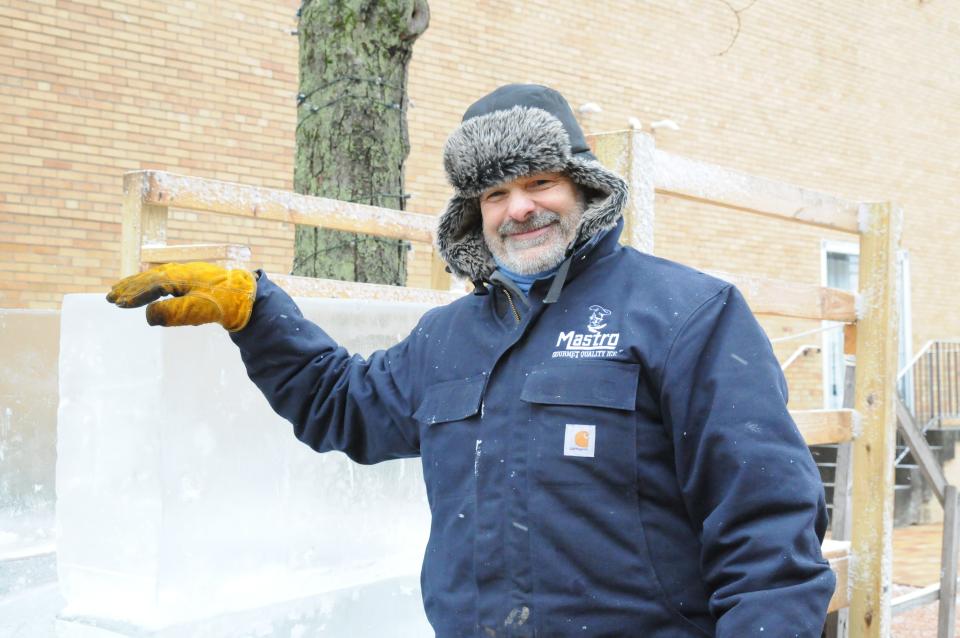 Working on a ice slide with his crew is Mike Mastro in Trinity Park.