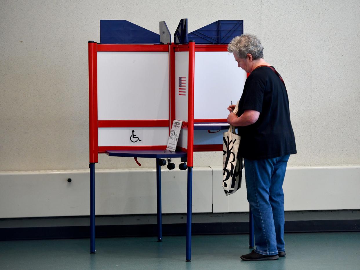 WORCESTER - Susan Keady fills out her ballot at the Worcester Public Library on Tuesday morning.