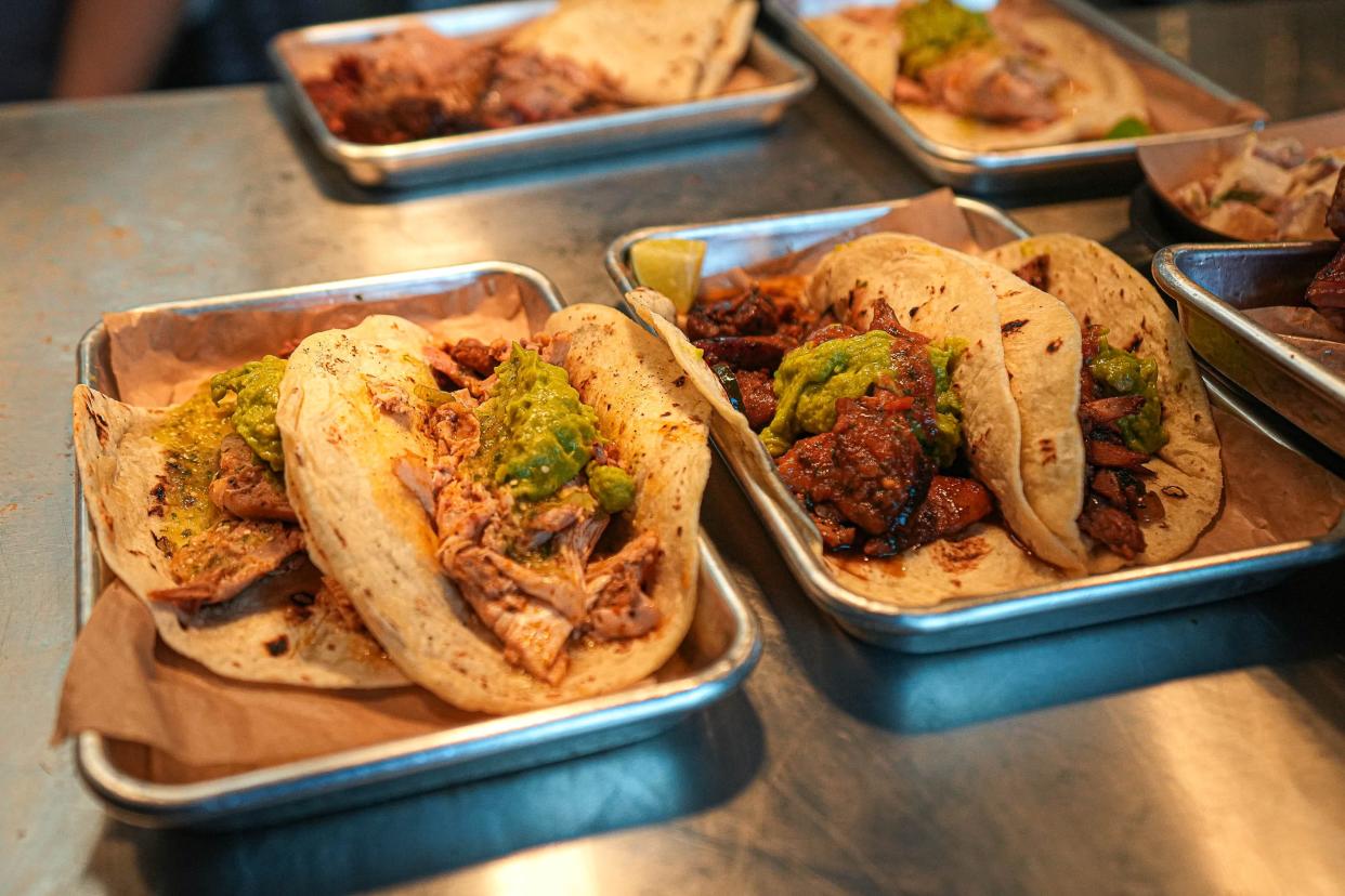 Chicken tacos, left, and pulled pork tacos, right, come out of the kitchen at Valentina's Tex Mex BBQ on Sunday, June 18, 2023 in Buda, Texas.