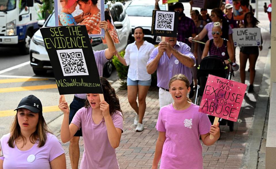 Supporters of Ashley Benefield march in downtown Bradenton ahead of her trial scheduled for July 22. Benefield is charged with second-degree murder for allegedly shooting her estranged husband in Sept. 2020.