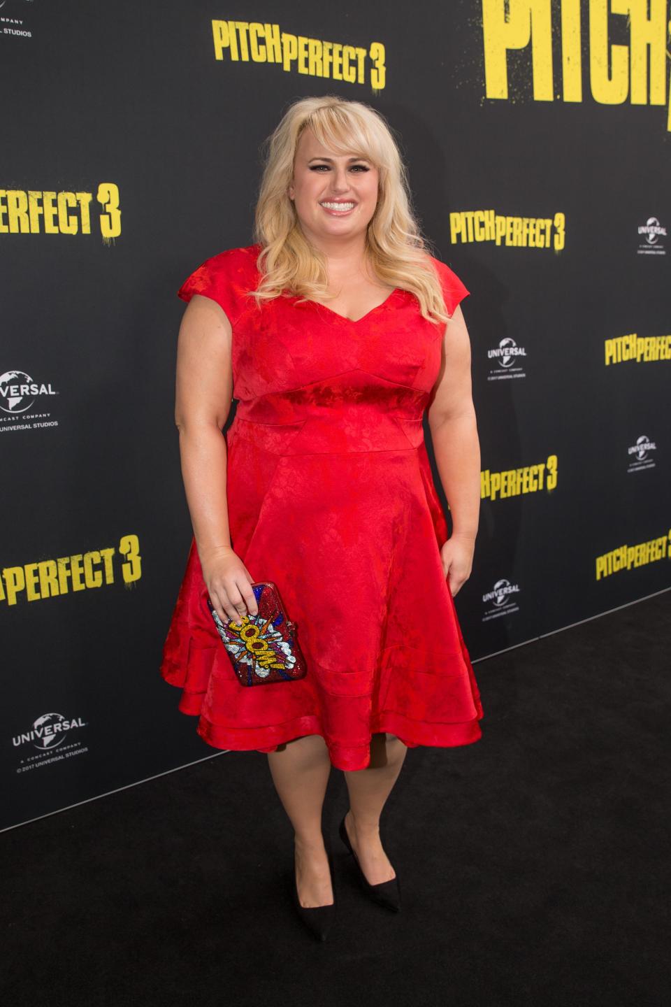 <p>Rebel still managed to keep the black carpet red hot as she wowed fans in a bright red dress.</p>