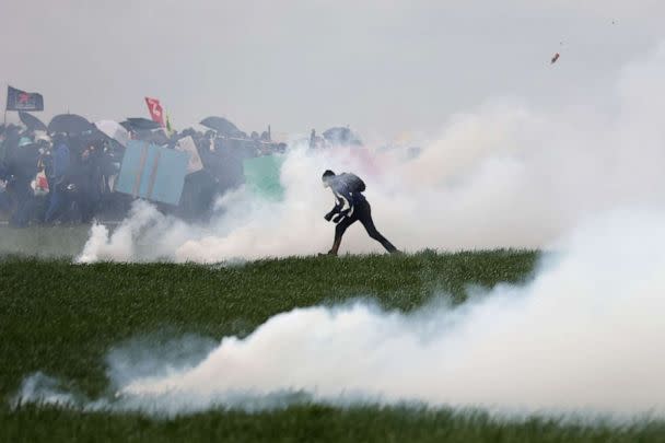 PHOTO: Protestors clash with French gendarmes during a demonstration called by the collective 'Bassines non merci', to protest against the construction of a new water reserve for agricultural irrigation, in Sainte-Soline, France, Mar. 25, 2023. (Thibaud Moritz/AFP via Getty Images)