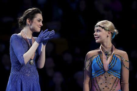 Figure Skating - ISU World Figure Skating Championships - Ladies Free Skate program - Boston, Massachusetts, United States - 02/04/16 - Gold medalist Evgenia Medvedeva of Russia (L) congratulates bronze medalist Anna Pogorilaya of Russia at the awards podium. REUTERS/Brian Snyder