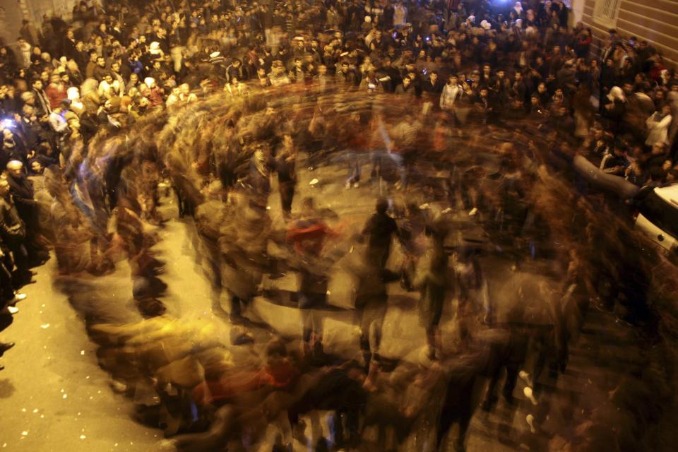 People dance as they celebrate in Diyarbakir, after Kurdish forces took full control of Kobani