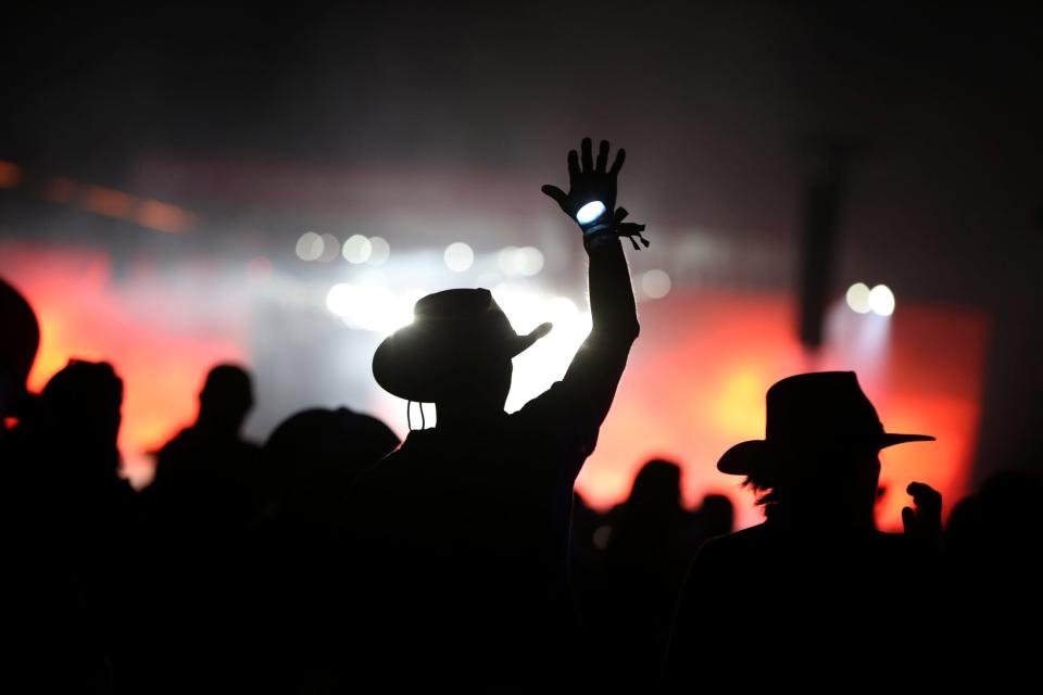 Fans of Kane Brown wear LED bracelets during the headlining performance on the Mane Stage during Stagecoach country music festival at the Empire Polo Club in Indio, Calif., Saturday, April 29, 2023.