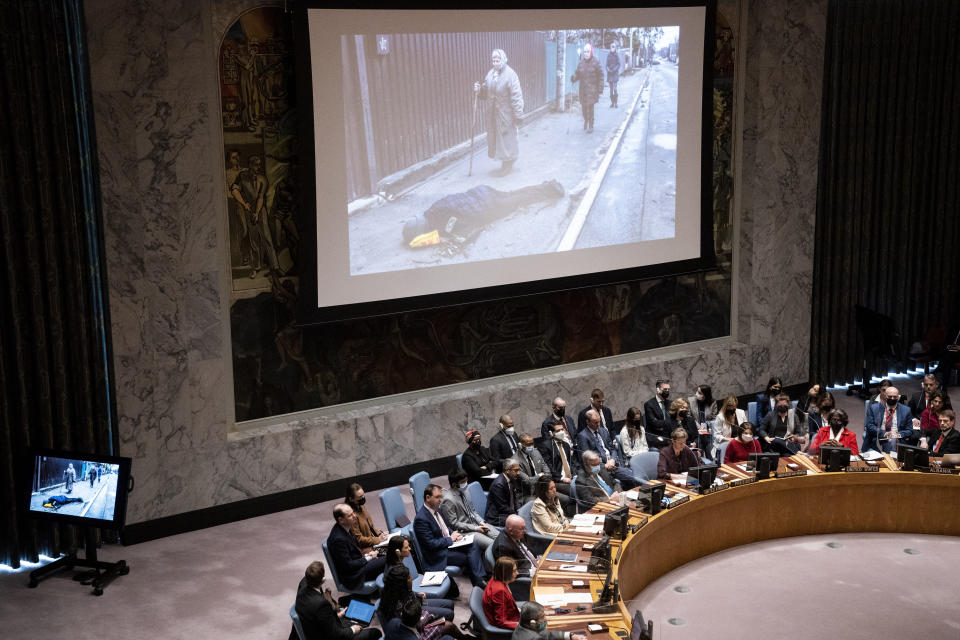 FILE - Images from devastation in Ukraine are displayed during a meeting of the UN Security Council, Tuesday, April 5, 2022, at United Nations headquarters. Ukrainian President Volodymyr Zelenskyy addressed the U.N. Security Council. (AP Photo/John Minchillo, File)