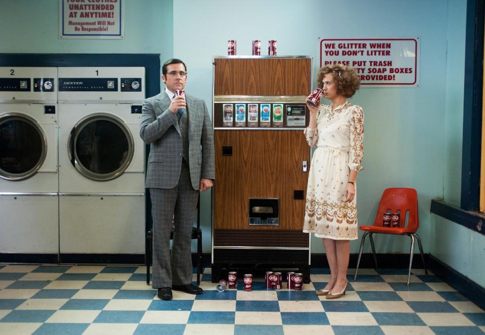 This photo provided by Paramount Pictures shows Steve Carell, left, as Brick Tamland and Kristen Wiig as Chani Lastnamé, in a scene from the film, "Anchorman 2: The Legend Continues." Paramount Pictures releases the film in the US on Dec. 18, 2013. (AP Photo/Paramount Pictures, Gemma LaMana)