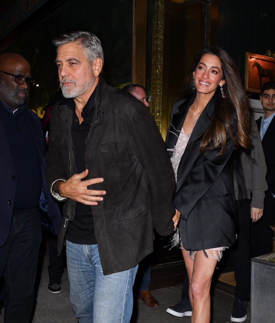 George Clooney and Amal Clooney leave the Polo Bar on December 14, 2023 in New York City.