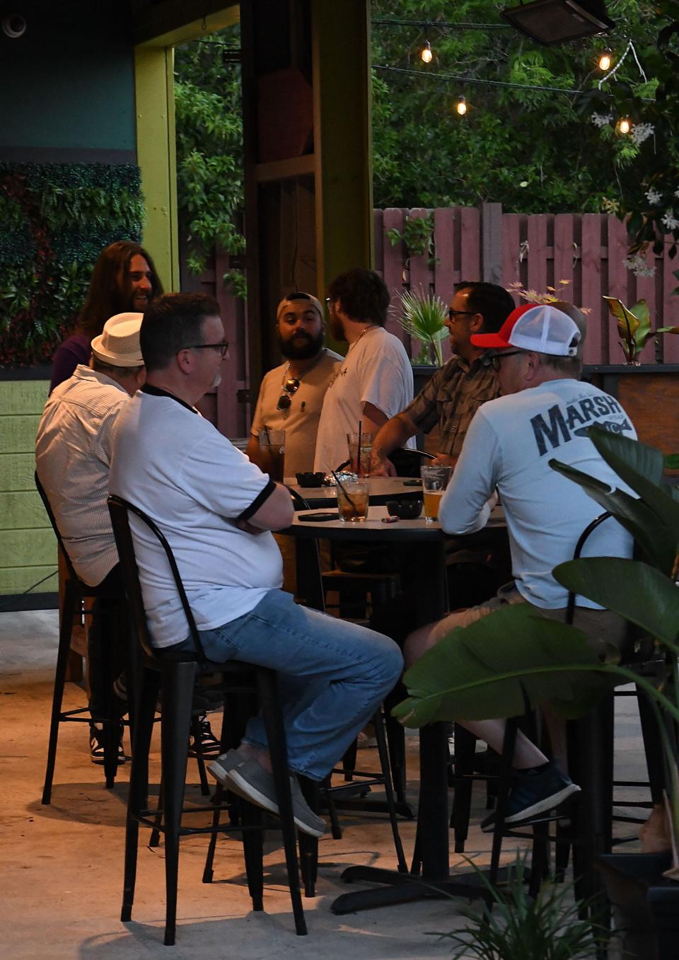 People enjoy the night at Dead Crow Thursday May 2, 2024 during open mic night in downtown Wilmington, N.C. KEN BLEVINS/STARNEWS