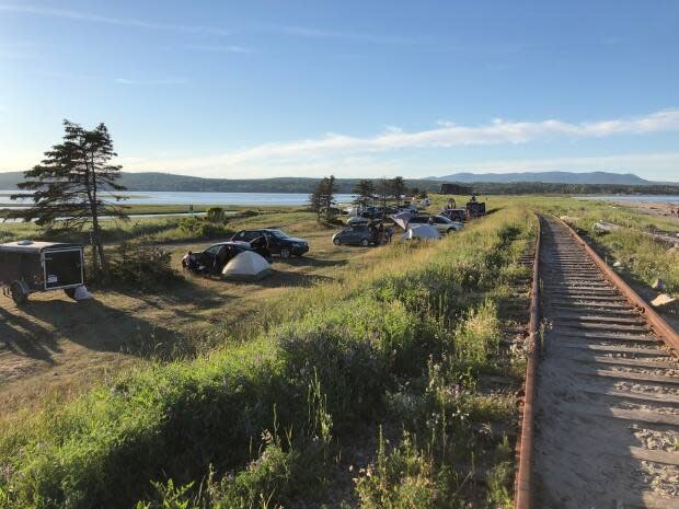 Campers set up makeshift sites along the beach in Douglastown, Que. last summer. 