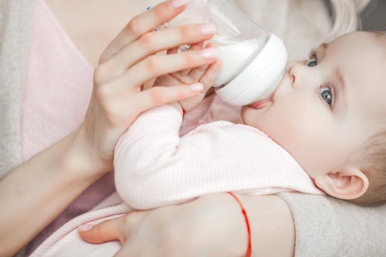 <span class="caption">A baby being fed formula milk.</span> <span class="attribution"><a class="link " href="https://www.shutterstock.com/image-photo/young-mother-feeding-her-little-cute-1300509853" rel="nofollow noopener" target="_blank" data-ylk="slk:Shutterstock/OlenaChukhil;elm:context_link;itc:0;sec:content-canvas">Shutterstock/OlenaChukhil</a></span>