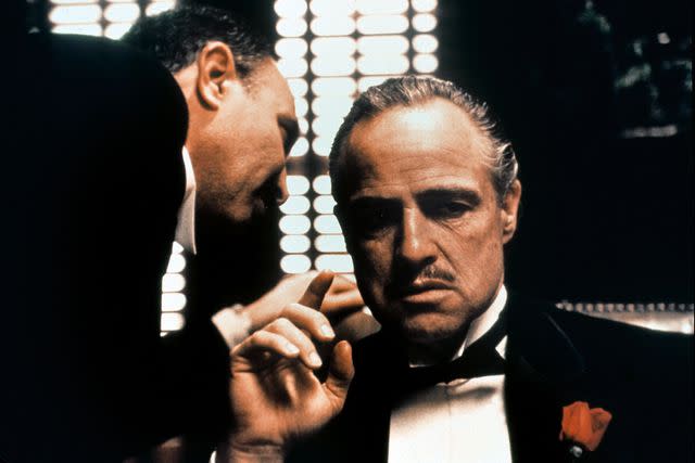 <p>EVERETT COLLECTION</p> Salvatore Corsitto and Marlon Brando in 'The Godfather'