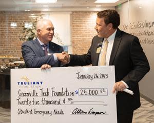 The Truliant Foundation made a $25,000 donation to the Greenville Tech Foundation Student Emergency Needs Fund to support students during financial hardship so they can continue to pursue their academic and career goals. In 2022, the fund helped 378 students with $174,000 in support.

Dr. Keith Miller, President of Greenville Technical College, (left), accepts the donation at Truliant's Upstate Regional Office reception. He is joined by Atticus Simpson, left, executive director of the Truliant Foundation.