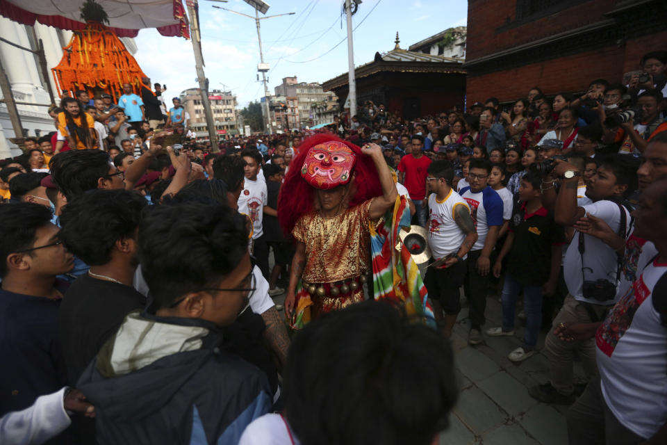 A traditional mask dancer, known as Lakhe, performs during Indra Jatra festival, an eight-day festival that honors Indra, the Hindu god of rain, in Kathmandu, Nepal, Friday, Sept. 13, 2019. During this festival, the girl child revered as the Living Goddess Kumari is pulled around Kathmandu in a wooden chariot, families gather for feasts and at shrines to light incense for the dead, and men and boys in colorful masks and gowns representing Hindu deities dance to the beat of traditional music and devotees' drums, drawing tens of thousands of spectators to the city's old streets. (AP Photo/Niranjan Shrestha)
