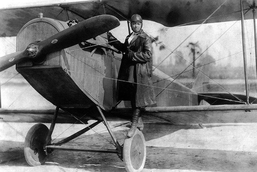 Bessie Coleman and her plane in 1922. Coleman, the first Black woman in America to earn a pilot's license, died four years later when she fell from a plane over Jacksonville.