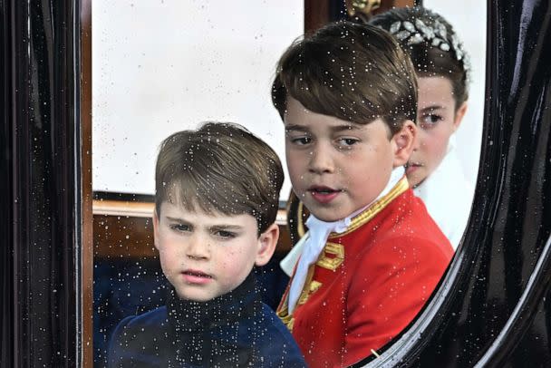 PHOTO: Britain&#39;s Prince Louis of Wales, Prince George of Wales and Princess Charlotte of Wales travel back to Buckingham Palace from Westminster Abbey after the coronation of King Charles III and Queen Camilla in London, May 6, 2023. (Oli Scarff/AFP via Getty Images)