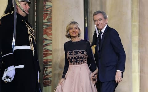 Bernard Arnault and his wife French pianist Helene Mercier-Arnault arrive to attend a state dinner for the Chinese president at the Elysee Palace in Paris - Credit: &nbsp;LUDOVIC MARIN/&nbsp;AFP