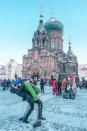 <p>The Switzers in Harbin, China, at St. Sophia Cathedral. (Caters News) </p>