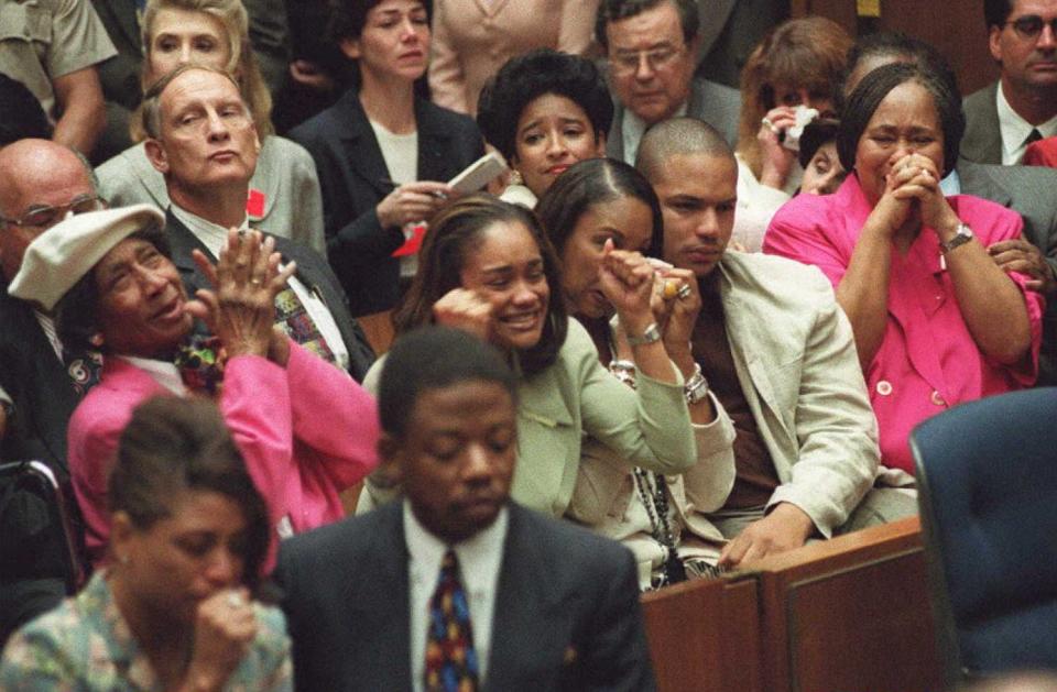 Simpson family members celebrate the not guilty verdicts in the murder trial of O.J. Simpson