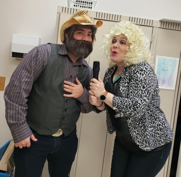 Megenbir dressed up as Kenny Rogers for Halloween in 2019 while his friend and colleague, Allison Boulanger, dressed up as Dolly Parton.