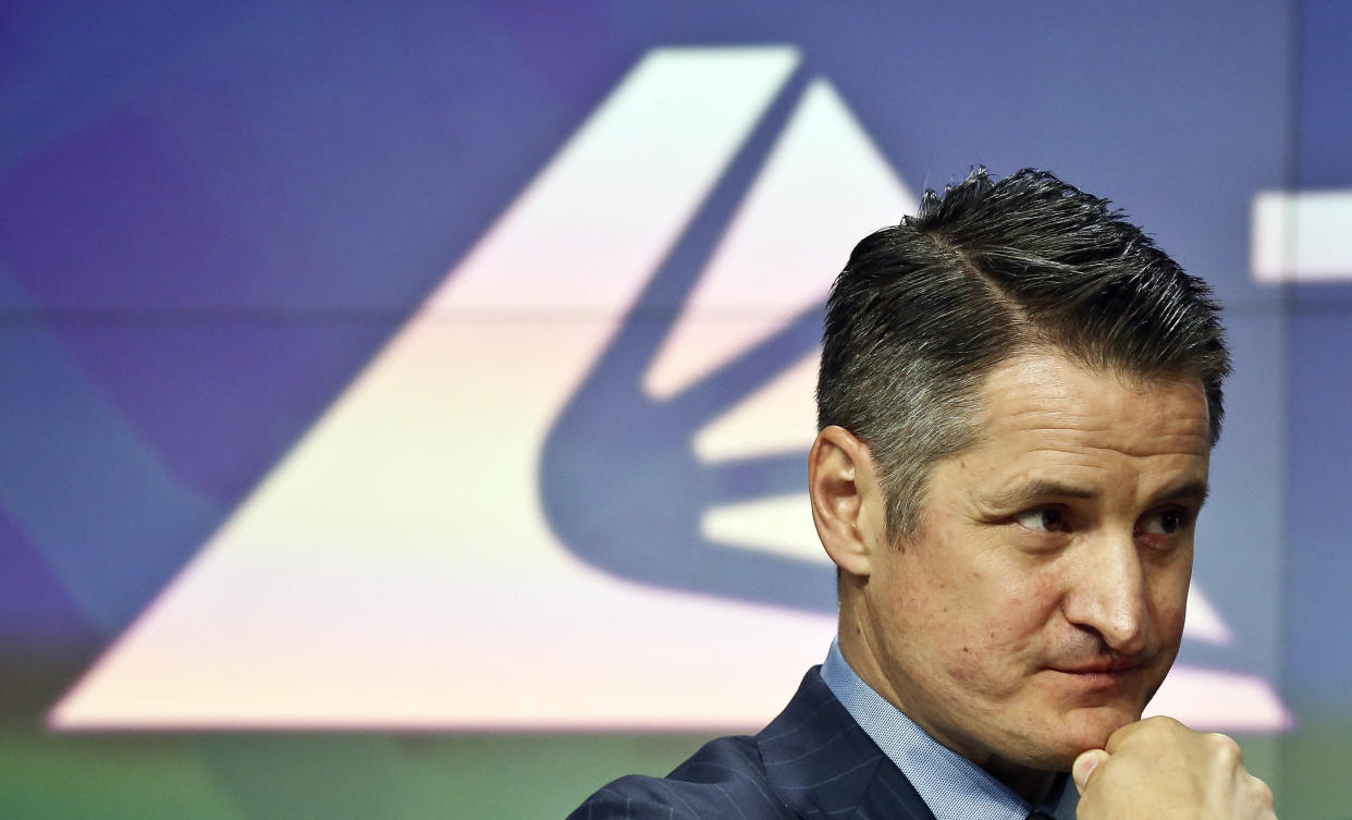 Brendan Kennedy, CEO and founder of British Columbia-based Tilray Inc., a major Canadian marijuana grower, poses next to his company's logo at Nasdaq where the company's IPO (TLRY) opened, Thursday, July 19, 2018, in New York. (AP Photo/Bebeto Matthews)