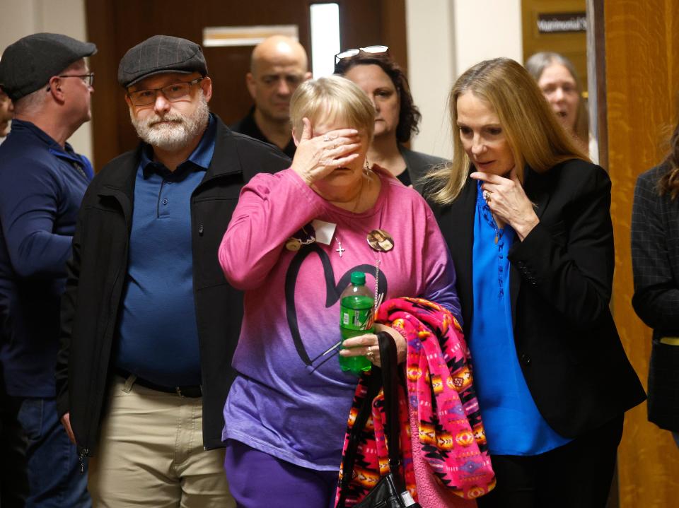 A grieving Marlene Jerome, mother of Wendy Jerome, leaves court with her son Bill and Monroe County District Attorney Sandra Doorley after the guilty verdict for Timothy Williams who raped and killed her daughter Wendy Jerome in 1984.