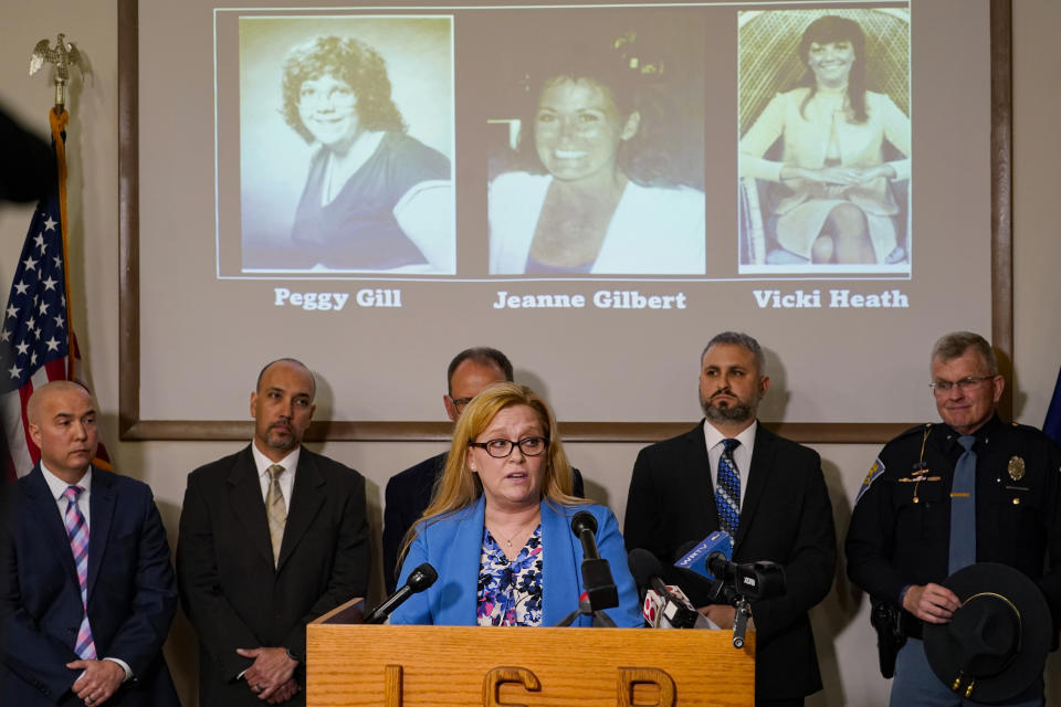 Peggy, Jeanne, and Vicki, victims of the I-65 Killer featured on a screen at a press conference