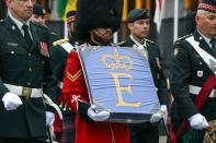 <p>A member of the Governor General's Foot Guards carries the Queen Elizabeth Canadian flag during a memorial service for Britain's Queen Elizabeth II in Ottawa on September 19, 2022. - Canadians said goodbye to Queen Elizabeth II with a parade through the capital Ottawa and smaller tributes across the nation -- a few hours after her London funeral.</p> <p>(Photo by DAVE CHAN/AFP via Getty Images)</p> 