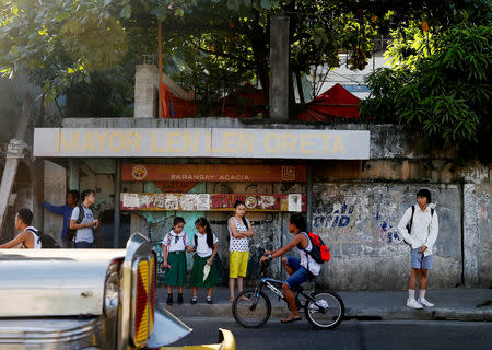 Oliver Emocling, 23, who works for a magazine, waits for a jeepney in Caloocan City, Philippines, November 29, 2018. Emocling travels about 16 kilometres to get to work. "I think it's really a struggle, especially here in Manila. Most jobs, especially in our line of work are in Makati City, Bonifacio Global City, and Pasig City, so you have to go out of your way to travel for at least an hour to get to work." REUTERS/Eloisa Lopez