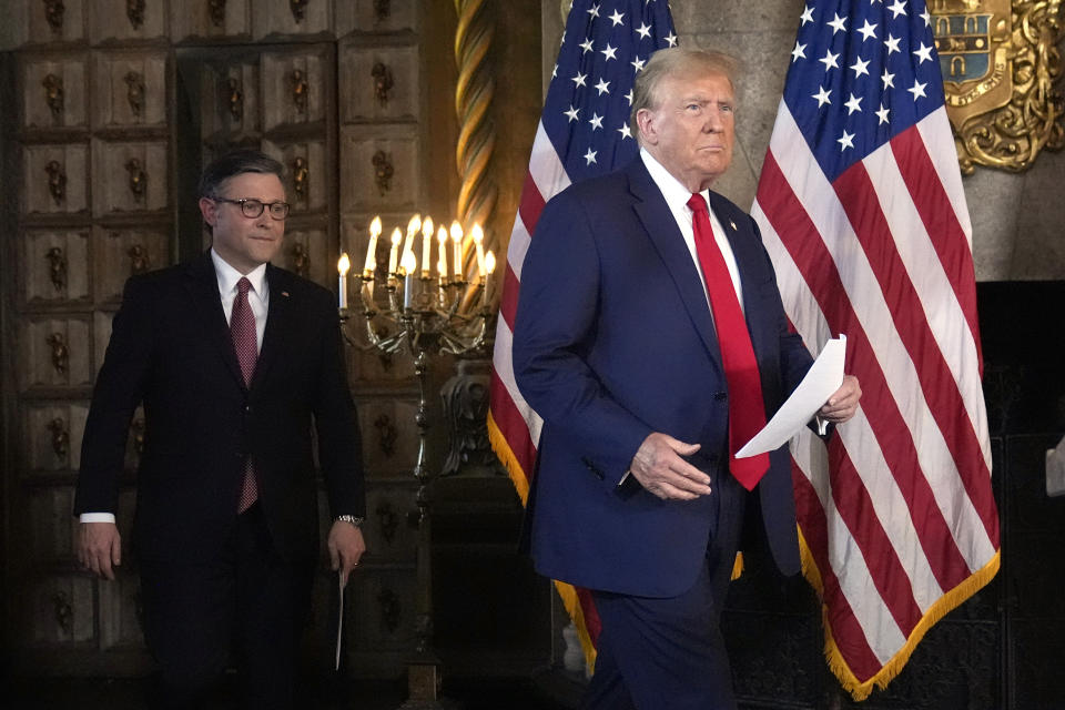 Republican presidential candidate former President Donald Trump, right, and Speaker of the House Mike Johnson, R-La., arrive at a news conference, Friday, April 12, 2024, at Mar-a-Lago in Palm Beach, Fla. (AP Photo/Wilfredo Lee)