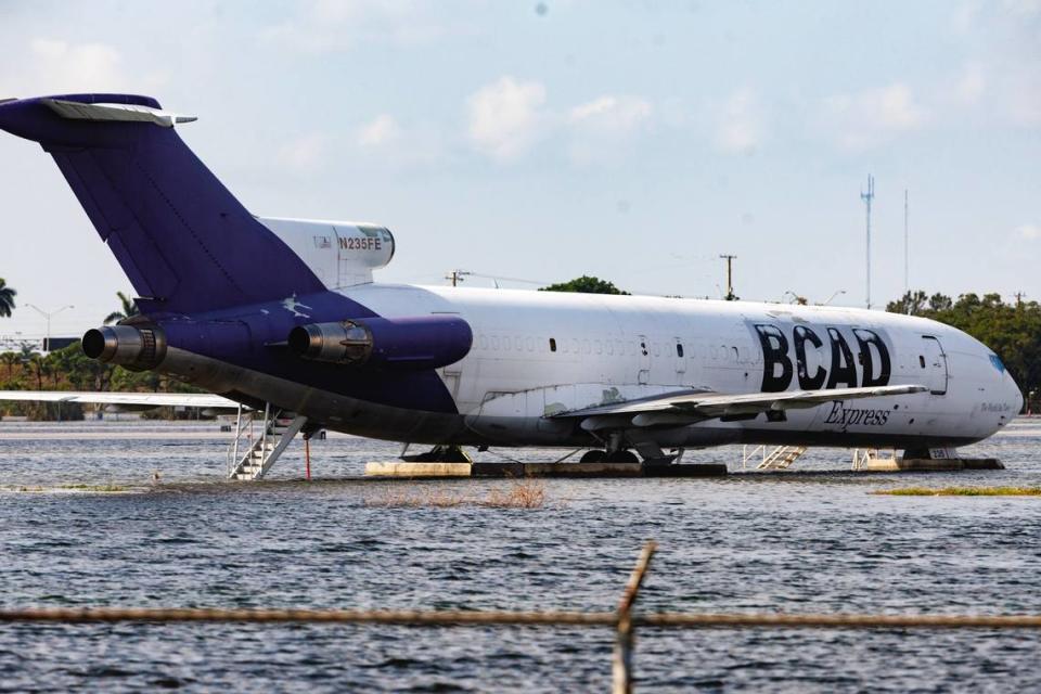 A BCAD Express airplane parked as the runway remains flooded from heavy rain at Fort Lauderdale-Hollywood International Airport on Thursday, April 13, 2023.