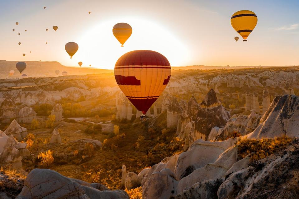 Float over Cappadocia at sunrise for the best views of its surreal tufa formations (Getty Images)