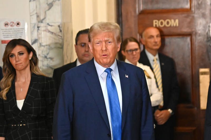 Former President Donald Trump enters the courtroom for his first day of testimony in his civil fraud trial at State Supreme Court on Monday, Nov. 6, in New York City. File Photo by Louis Lanzano/UPI