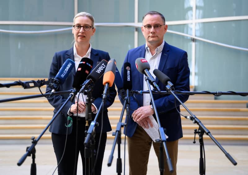 Alice Weidel (L), Chairwoman of the AfD parliamentary group, and Tino Chrupalla, Chairman of the AfD parliamentary group, comment in the German Bundestag on the ruling of the North Rhine-Westphalian Higher Administrative Court (OVG) on the classification of the AfD as a suspected right-wing extremist organization. German far-right AfD leaders say lawmaker raids are 'serious matter'. Bernd von Jutrczenka/dpa