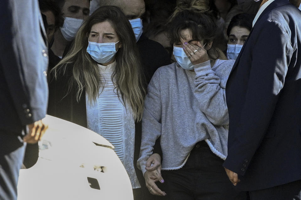 The daughters of the late Argentine football legend Diego Maradona, Dalma (L) and Giannina, leave the Casa Rosada presidential palace at the end of the wake in Buenos Aires on November 26, 2020.