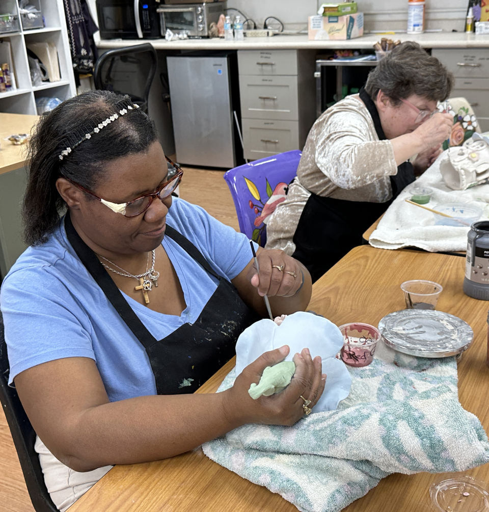 Artists Patty, left, and Denise work on ceramic pieces at Happiness House at Easterseals Southwest Florida.